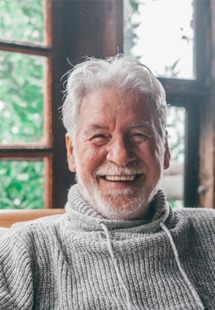 Closeup of senior man smiling at home