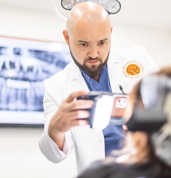 Oral surgeon taking a photo of a patient