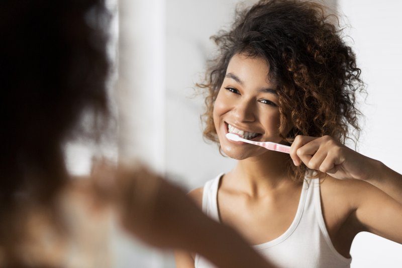 Patient brushing their teeth for dental hygiene month